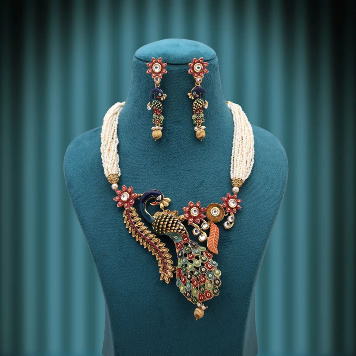 Peacock Inspired Matte Gold Necklace Set With Royal Ethnic Design Appeal